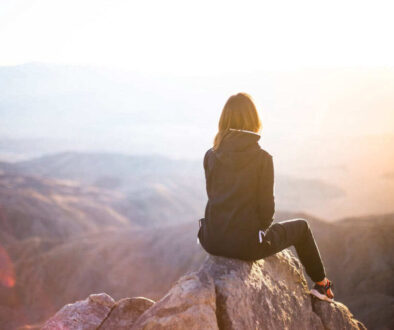 girl-at-top-of-mountain