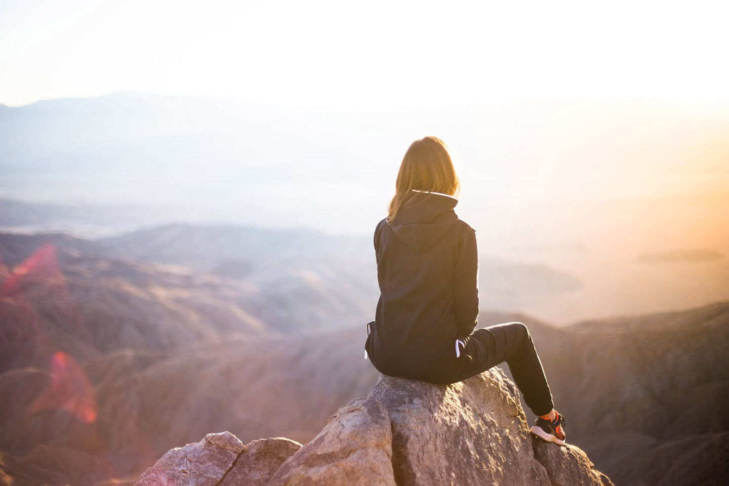 girl-at-top-of-mountain